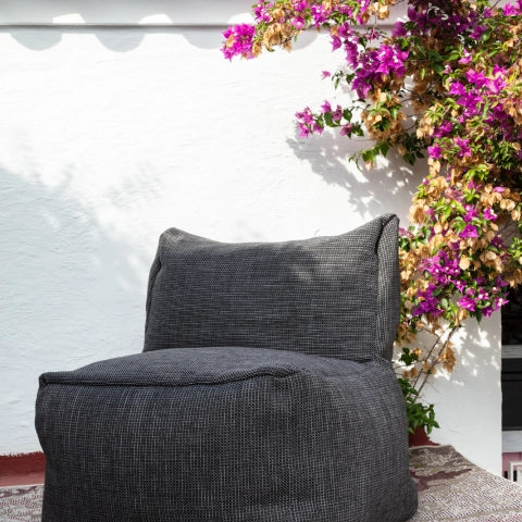 Gray outdoor lounge seat by HoekbankXXL, featuring a dotted weave texture, with a high back.