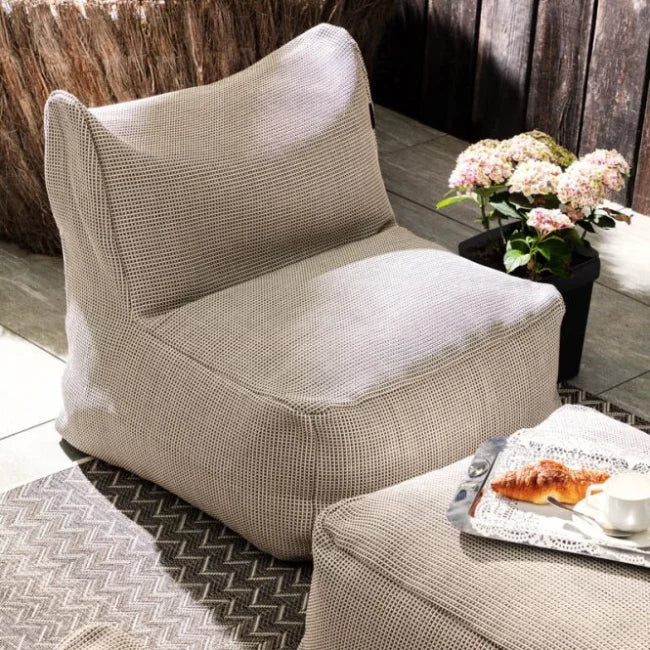 Dotty beige loungestoel tuin met voetenbank, waterdicht – HoekbankXXL